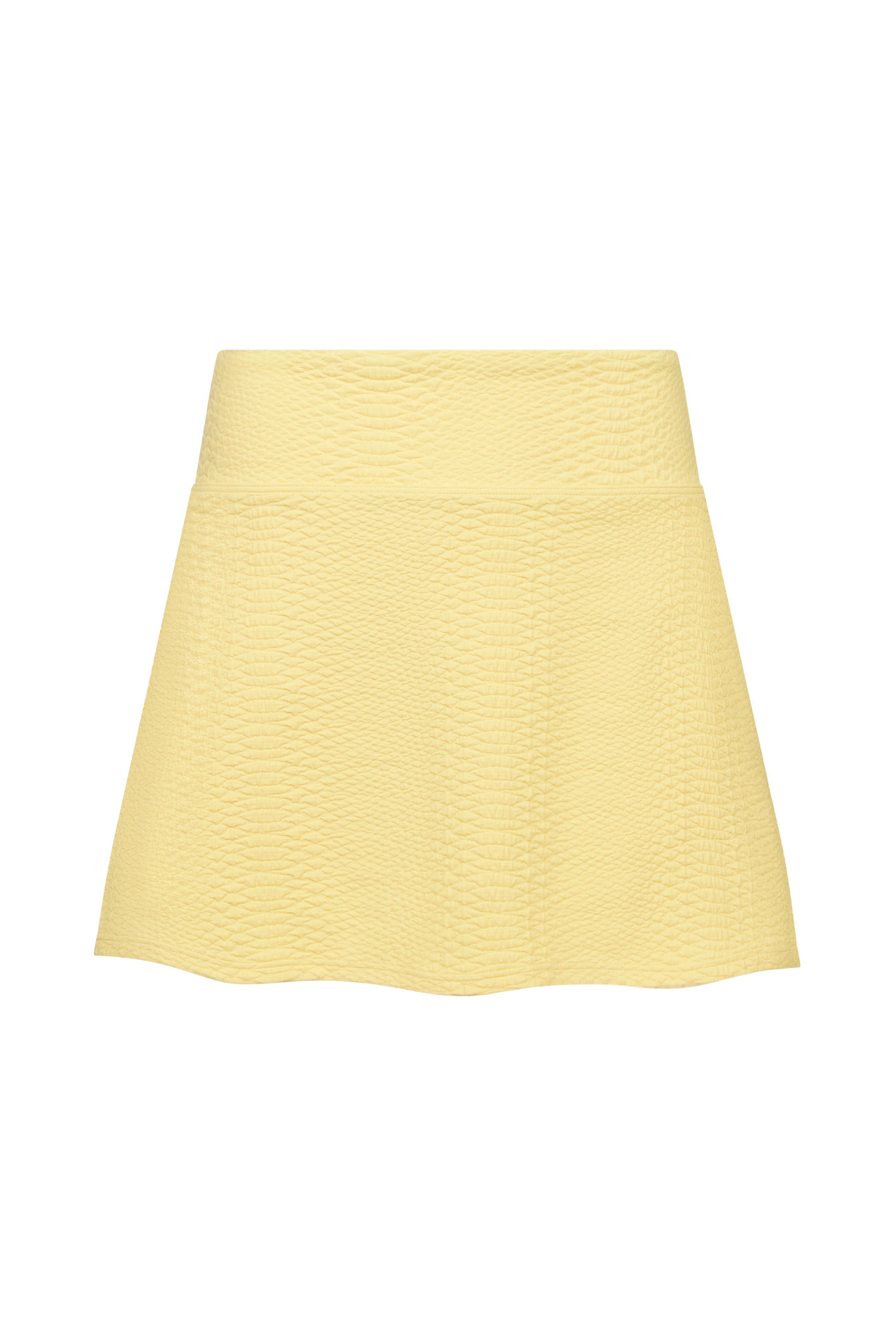 The Heidi Snakeskin Skort by Gigi C Sport features yellow, snakeskin-embossed textured fabric, a wide waistband, and built-in shorts. Displayed against a white background.