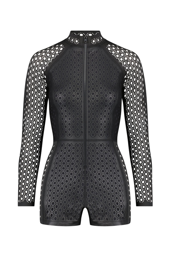 The Rowen Surfsuit by Gigi C Bikinis is a sleek black long-sleeve romper made from premium wax-coated scuba fabric. It features geometric cut-outs with circular and star designs on the sleeves and body, plus a zip-up front for a perfect swim look.